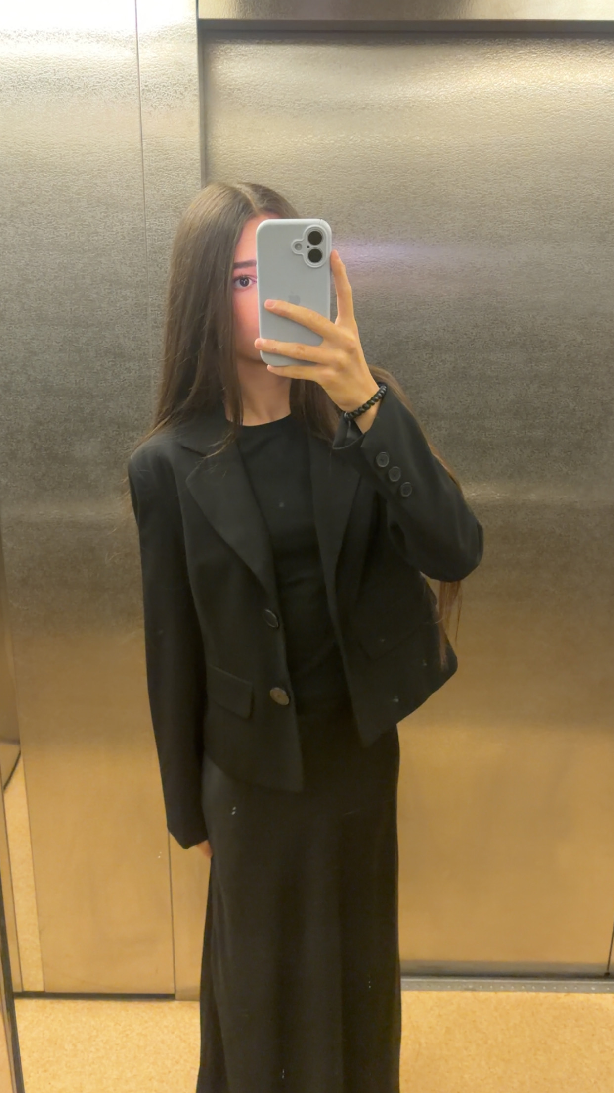 Mirror portrait wearing a black outfit